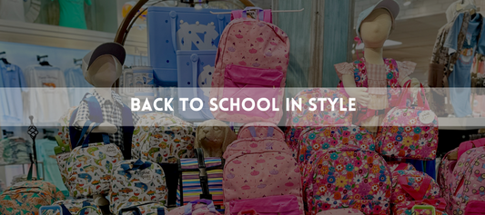 a boy and girl mannequin wearing backpacks 