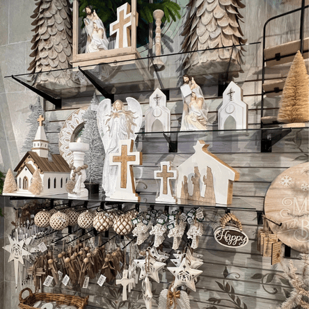Decorative angel figurines, crosses, and small churches  in the moments in thyme room at Dewayne's in Selma, NC