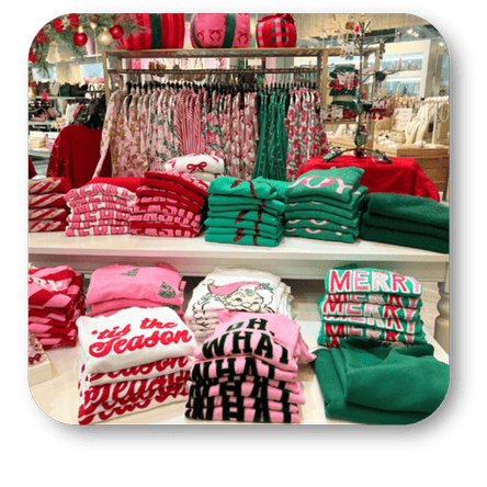 Display of Christmas-themed clothing in the boutique at Dewayne's in Selma, NC minutes from Raleigh, Cary, Clayton, Garner, Smithfield, Goldsboro