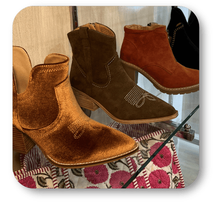 Pair of brown suede ankle boots in the boutique at Dewayne's in Selma, NC minutes from Raleigh, Cary, Clayton, Garner, Smithfield, Goldsboro
