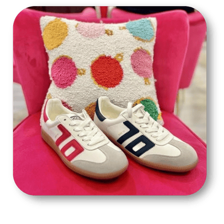 Back70 sneakers on a pink chair with a patterned pillow in the boutique at Dewayne's in Selma, NC minutes from Raleigh, Cary, Clayton, Garner, Smithfield, Goldsboro.
