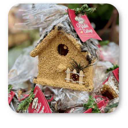 Decorative birdhouse with a 'Belle Cottage' tag, at Dewayne's in Selma, NC minutes from Raleigh, Cary, Clayton, Garner, Smithfield, Goldsboro