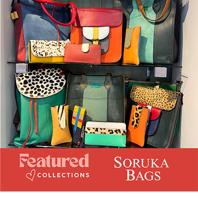 Display of various colorful soruka handbags  in the boutique at dewayne's