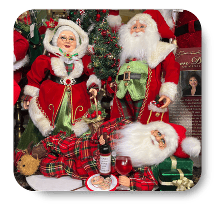 Decorative Christmas scene with Santa Claus figurines, a bottle of wine, and cookies  in christmas land at Dewayne's in Selma, NC minutes from Raleigh, Cary, Clayton, Garner, Smithfield, Goldsboro