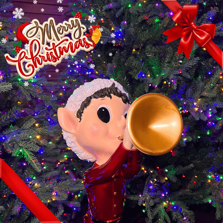 Elf figurine with a gold horn in front of a Christmas tree with lights at Dewayne's in Selma, NC