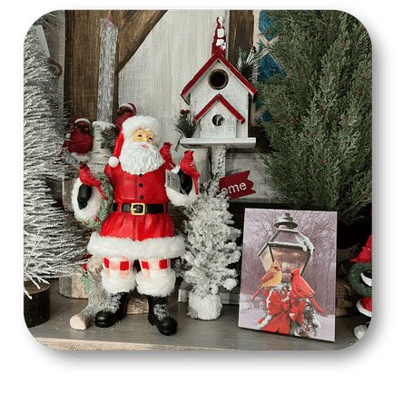 Decorative scene with Santa Claus figure, birdhouse, and Christmas trees in the country Christmas room of Christmas Land 2025 at Dewayne's in Selma, NC minutes from Raleigh, Cary, Clayton, Garner, Smithfield, Goldsboro