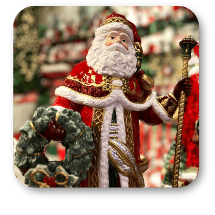 Decorative ceramic Fitz & Floyd Santa in a red and gold outfit with a wreath, against a festive background at Dewayne's in Selma, NC minutes from Raleigh, Cary, Clayton, Garner, Smithfield, Goldsboro