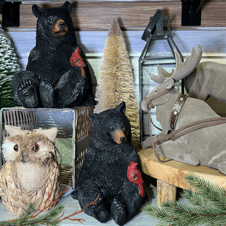 Decorative black bears, owl, and moose with a lantern and Christmas trees in the country christmas room at Dewayne's in Selma, NC
