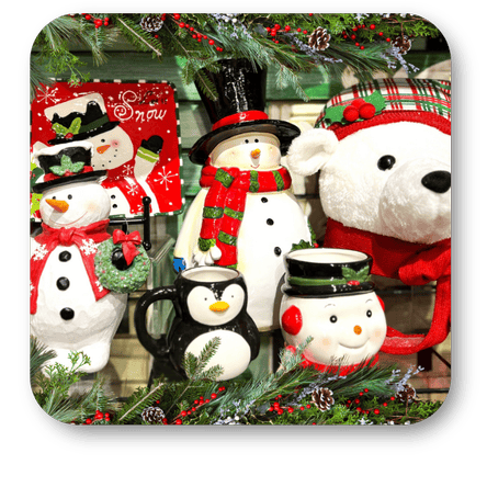 Decorative Christmas items including snowmen, penguins, and a teddy bears with festive attire in the grand entrance room of christmas land 2025 at Dewayne's in Selma, NC minutes from Raleigh, Cary, Clayton, Garner, Smithfield, Goldsboro