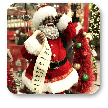 Decorative African American Santa Claus figure with a beard, standing in a store with Christmas decorations in the grand entrance room in christmas land 2025 at Dewayne's in Selma, NC minutes from Raleigh, Cary, Clayton, Garner, Smithfield, Goldsboro
