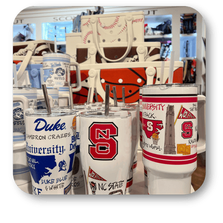Collection of tumblers with various university logos and designs at Dewayne's in Selma, NC minutes from Raleigh, Cary, Clayton, Garner, Smithfield, Goldsboro