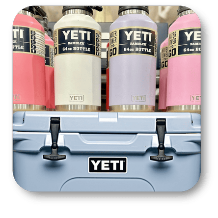 YETI brand bottles displayed on a shelf with a cooler in the foreground  in the gift shop at Dewayne's in Selma, NC minutes from Raleigh, Cary, Clayton, Garner, Smithfield, Goldsboro