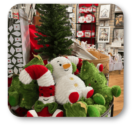 Plush toys including a snowman and green elves at Dewayne's in Selma, NC minutes from Raleigh, Cary, Clayton, Garner, Smithfield, Goldsboro