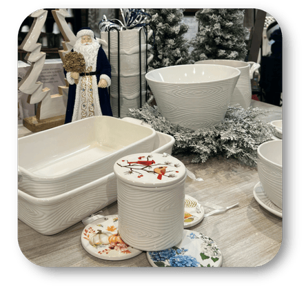 White ceramic serveware including a large bowl, smaller containers, and decorative plates at Dewayne's in Selma, NC minutes from Raleigh, Cary, Clayton, Garner, Smithfield, Goldsboro