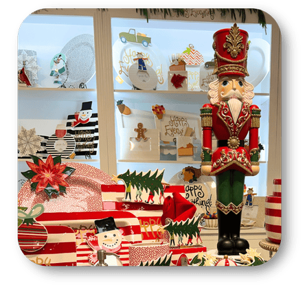 Happy Everything brand Decorative nutcracker figure in a festive setting with Christmas-themed serveware at Dewayne's in Selma, NC minutes from Raleigh, Cary, Clayton, Garner, Smithfield, Goldsboro