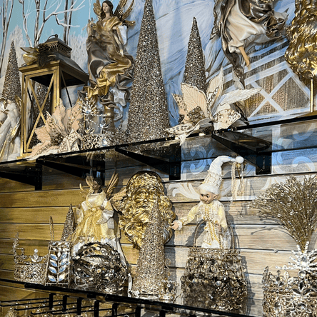 Decorative gold and silver christmas elves figurines in the gold and glamour room at Dewayne's in Selma, NC
