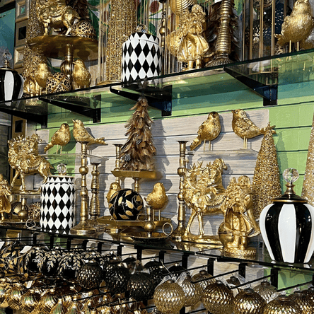 Decorative gold, white and black christmas decor, vases, and ornaments in the gold and glamour room at Dewayne's in Selma, NC