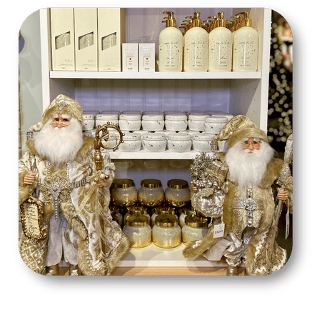 Decorative gold santa figurines with holiday scents in the gold and glamour room in christmas land 2025 at Dewayne's in Selma, NC minutes from Raleigh, Cary, Clayton, Garner, Smithfield, Goldsboro