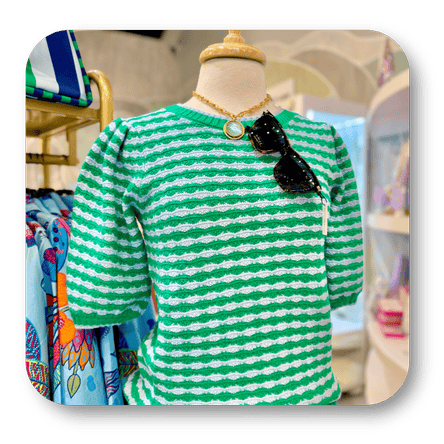 Green and white striped shirt on a mannequin with sunglasses in the boutique at Dewayne's in Selma, NC minutes from Raleigh, Cary, Clayton, Garner, Smithfield, Goldsboro