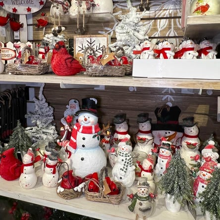 Display of Christmas-themed decorations including snowmen in the country christmas room at Dewayne's in Selma, NC