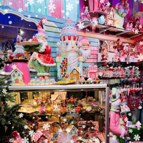 Colorful Christmas-sweet themed decorations including gingerbread houses and candy canes in Kringle's Kitchen in Christmas land 2025 at dewayne's
