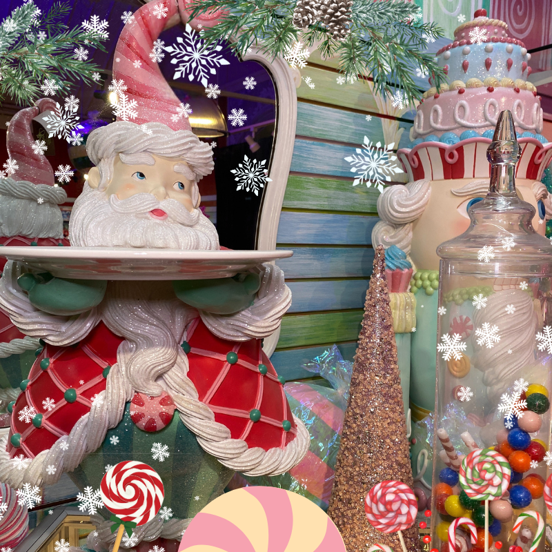 Decorative Santa Claus figure, candy, and Christmas trees in Kringle's Kitchen in Christmas land 2025 at dewayne's