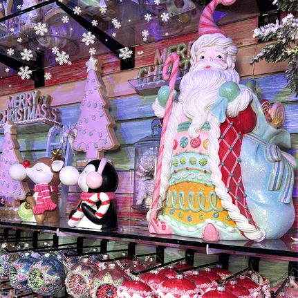 Decorative Santa Claus figure with candy canes and Christmas-themed background in Kringle's kitchen in christmas land 2025 at dewayne's