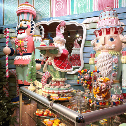 Decorative Nutcracker display with candy and pastries in a festive setting in Kringle's kitchen in christmas land 2025 at dewayne's