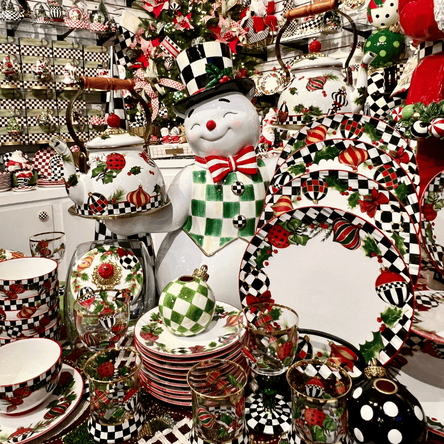 mackenzie-childs christmas collection dinnerware and serveware in the grand entrance room in christmas land 2025 at dewayne's