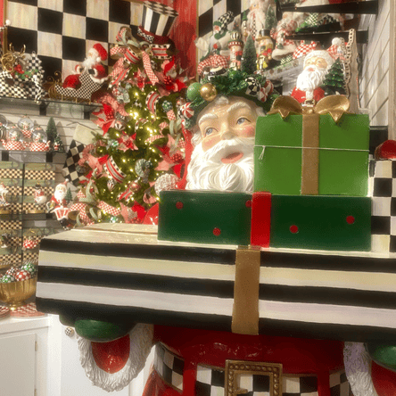 mackensie-childs christmas collection with large santa  in the grand entrance room in christmas land 2025 at dewayne's