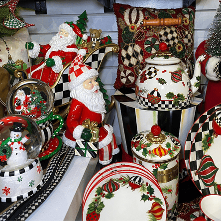mackensie-childs snow globes, teapots and santas  in the grand entrance room in christmas land 2025 at dewayne's