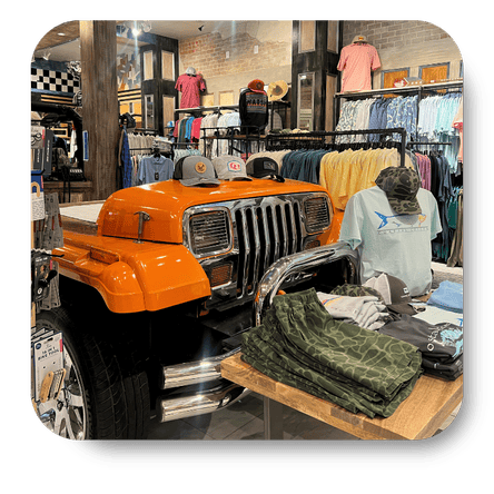 Men's clothing surrounding jeep in the men's shoppe at Dewayne's in Selma, NC minutes from Raleigh, Cary, Clayton, Garner, Smithfield, Goldsboro