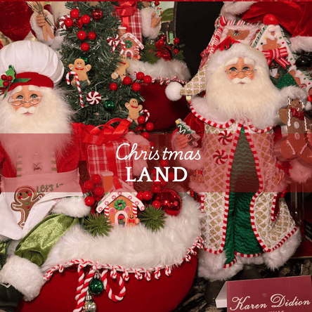 Decorative Christmas scene with Santa Claus figures and a tree on a red background  in Christmas Land at Dewayne's in Selma, NC minutes from Raleigh, Cary, Clayton, Garner, Smithfield, Goldsboro