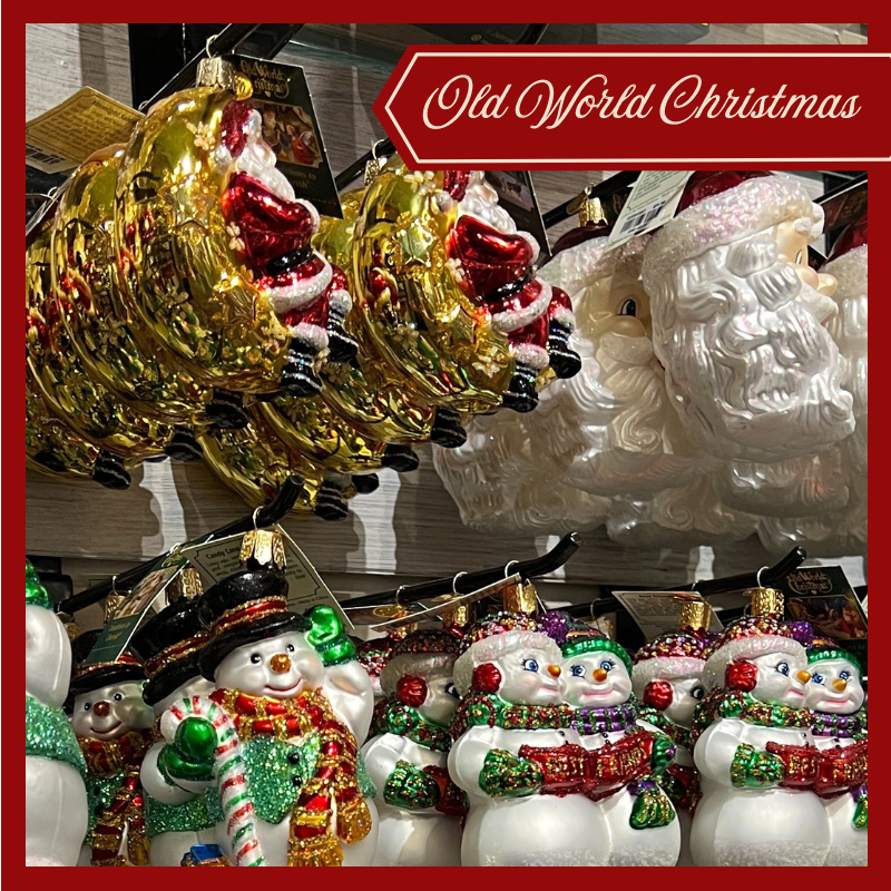 Collection of Christmas ornaments including gold reindeer, white Santa Claus, and colorful snowmen by 'Old World Christmas' brand
