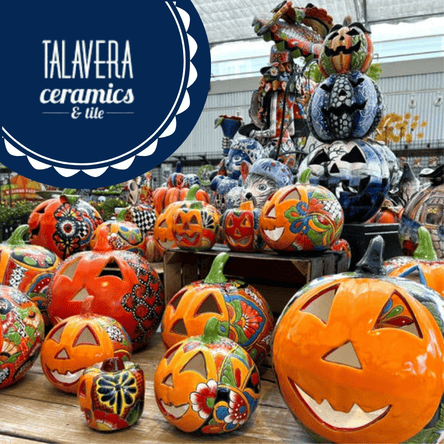 Colorful handmade ceramic pumpkins with 'Talavera Ceramics & Tile' branding in the garden center at dewayne's