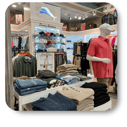 Mannequin wearing a red shirt - tommy bahama clothing and caps in the men's shoppe at Dewayne's in Selma, NC minutes from Raleigh, Cary, Clayton, Garner, Smithfield, Goldsboro