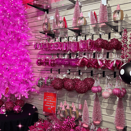 hot pink Christmas tree, decor and pink ornaments in the wrapped in red room in christmas land at dewayne's in selma, nc