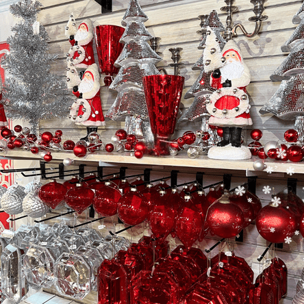 silver and red Christmas decor and santas in the wrapped in red room in christmas land at dewayne's in selma, nc