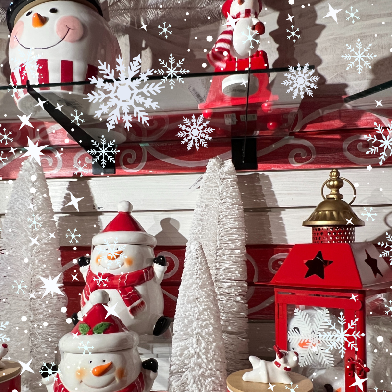 Decorative Christmas ceramic snowmen cookies jars ad mugs and holiday,lanterns in the wrapped in red room in christmas land 2025 at dewaynes
