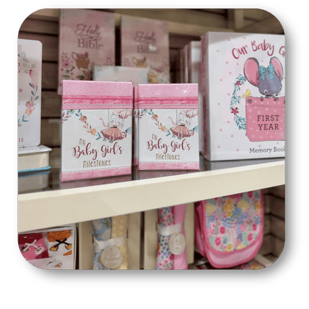 Collection of baby-themed books in the gift shop at Dewayne's in Selma, NC minutes from Raleigh, Cary, Clayton, Garner, Smithfield, Goldsboro