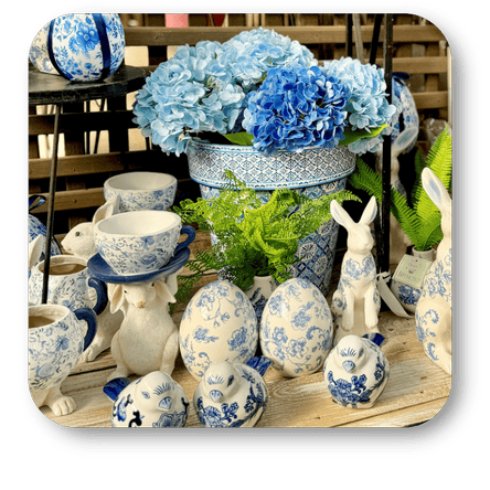 Decorative  blue and white faux hydrangeas, teacups, and ceramic garden bunnies in the greenhouse atrium at Dewayne's in Selma, NC minutes from Raleigh, Cary, Clayton, Garner, Smithfield, Goldsboro