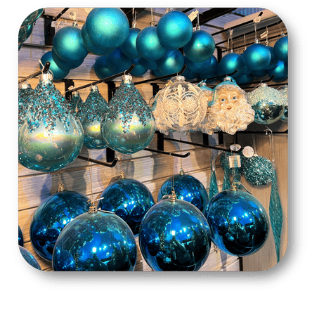 Collection of blue and teal Christmas ornaments in Christmas Land at Dewayne's in Selma, NC minutes from Raleigh, Cary, Clayton, Garner, Smithfield, Goldsboro
