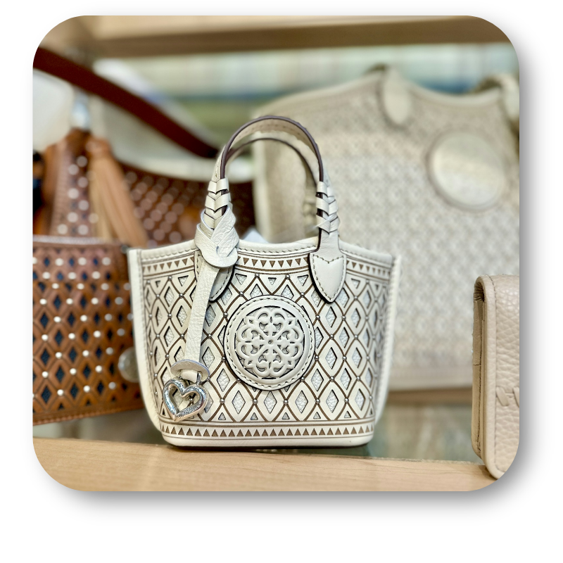 Brighton neutral handbags with intricate patterns in the boutique at Dewayne's in Selma, NC minutes from Raleigh, Cary, Clayton, Garner, Smithfield, Goldsboro