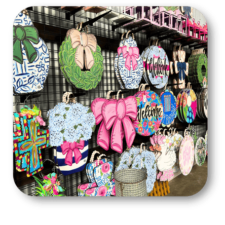Decorative spring door signs in the greenhouse atrium at Dewayne's in Selma, NC minutes from Raleigh, Cary, Clayton, Garner, Smithfield, Goldsboro