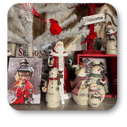 Decorative Christmas  Santa Claus, snowmen, and cardinal birds in the country Christmas room of Christmas Land at Dewayne's in Selma, NC minutes from Raleigh, Cary, Clayton, Garner, Smithfield, Goldsboro