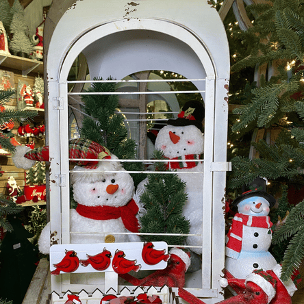 Decorative display with snowmen and Christmas trees in the country christmas room in christmas land 2025 at Dewayne's in Selma, NC