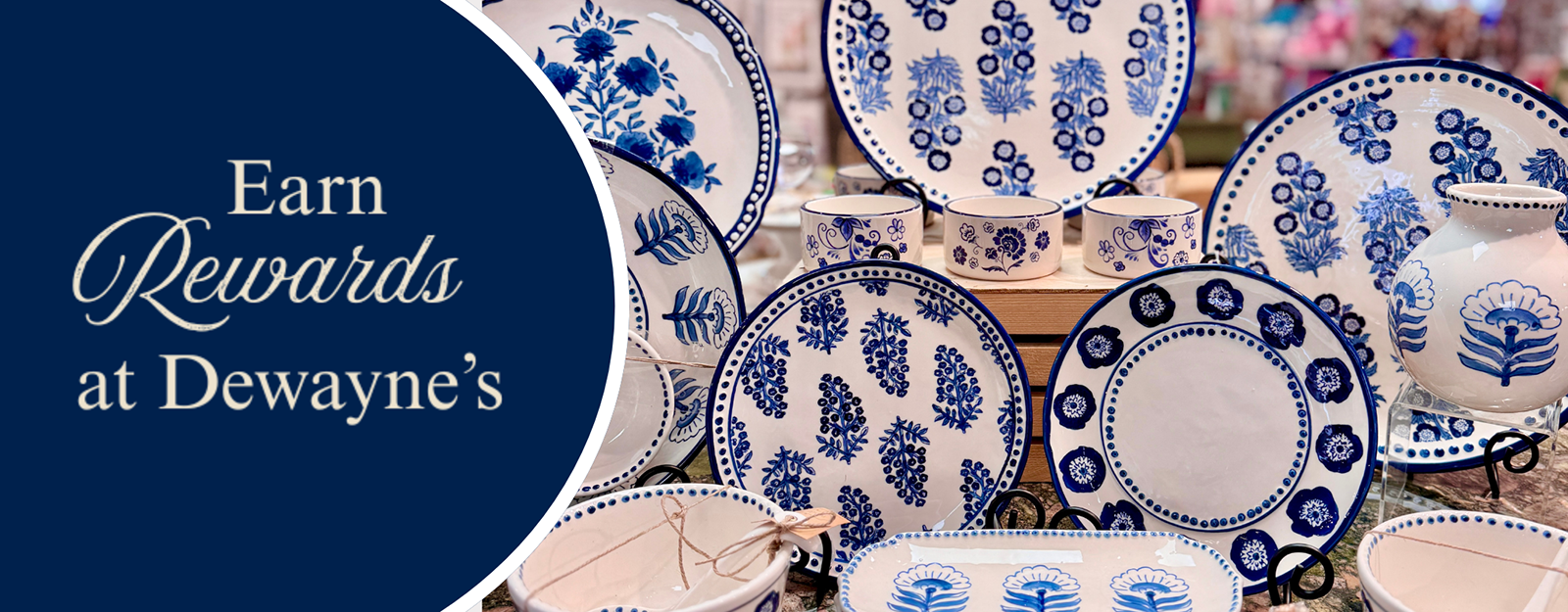 Blue and white ceramic plates and bowls with decorative patterns on a blue background, featuring text 'Earn Rewards at Dewayne's'.