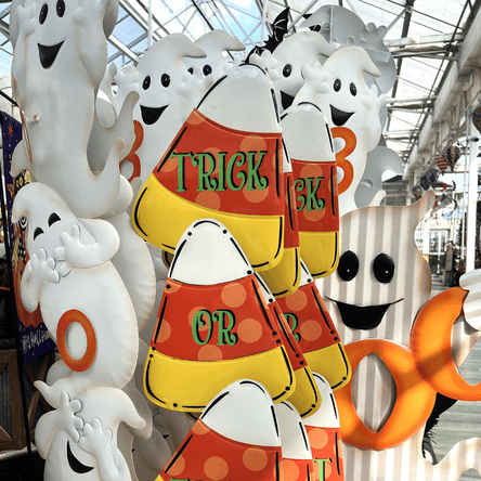 Halloween yard decorations with ghost figures and candy corn design in the garden center at dewayne's