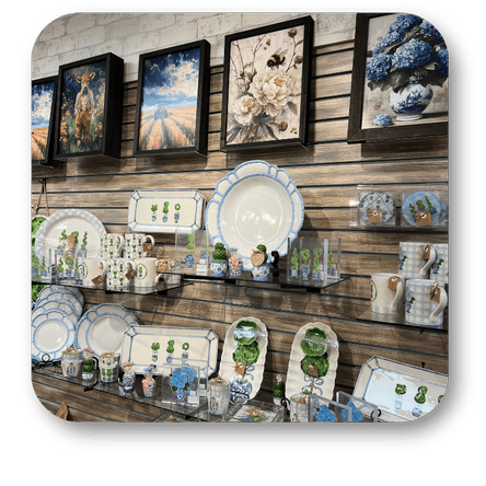 Collection of framed artwork and spring serveware in the gift shop at Dewayne's in Selma, NC minutes from Raleigh, Cary, Clayton, Garner, Smithfield, Goldsboro