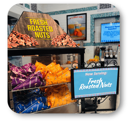 Display case with fresh roasted nuts and snack bags in the sweet shop at Dewayne's in Selma, NC minutes from Raleigh, Cary, Clayton, Garner, Smithfield, Goldsboro